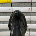 Unisex black glossy sneaker toe and front panel with textured seam