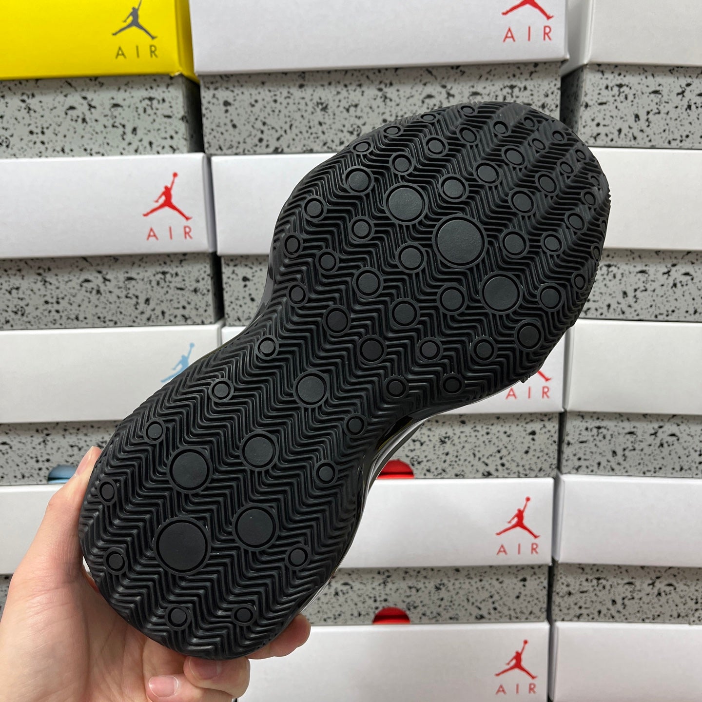 Unisex black sneaker outsole with geometric tread pattern