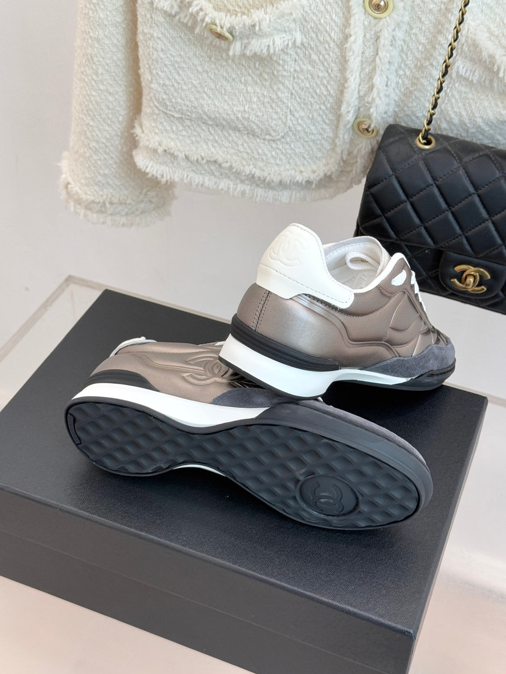 Ladies sneakers side and outsole view in metallic beige with white soles and laces