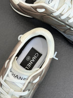 Close-up of sneaker tongue with Chanel label inside collar