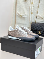 Chanel ladies sneakers in metallic beige with white laces and dark rubber sole
