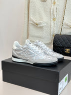 Chanel ladies white sneakers with quilted side panels and white laces