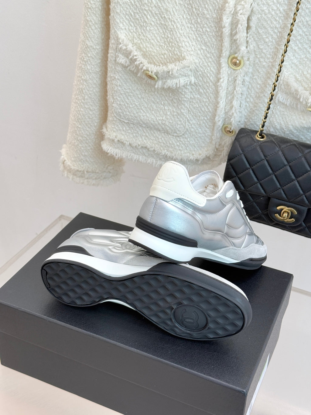 Chanel ladies white sneakers heel view with textured rubber sole