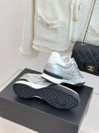Chanel ladies white sneakers heel view with textured rubber sole