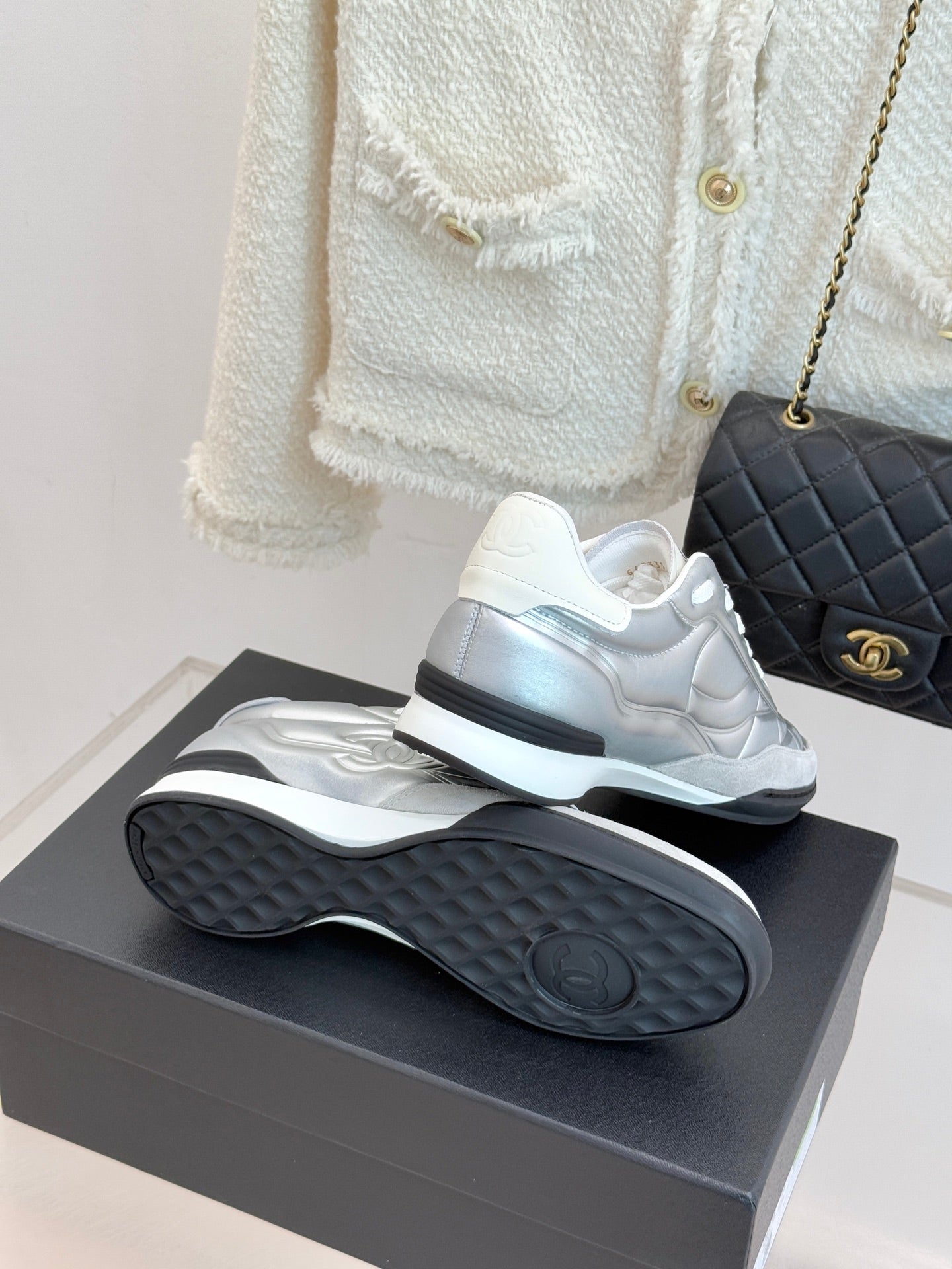 Chanel ladies white sneakers heel view with textured rubber sole