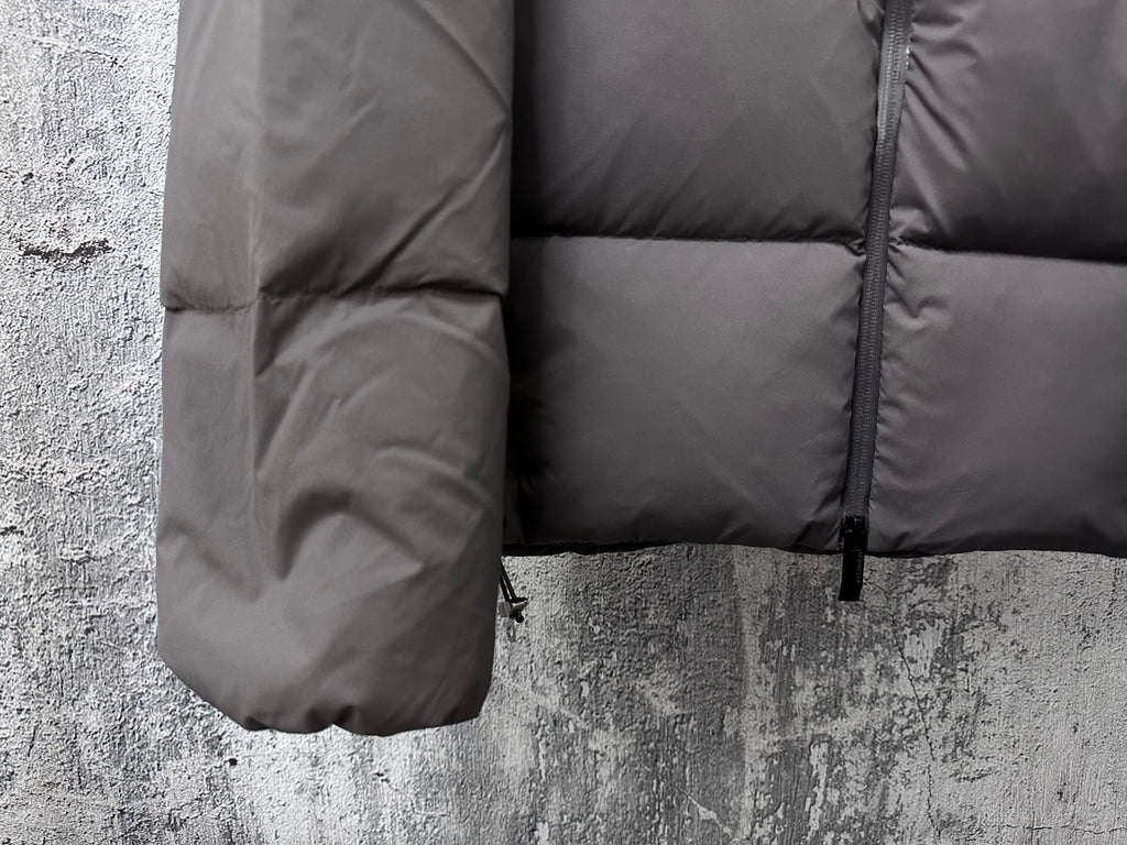 Long padded jacket side panel with quilted sections and zipper, dark gray