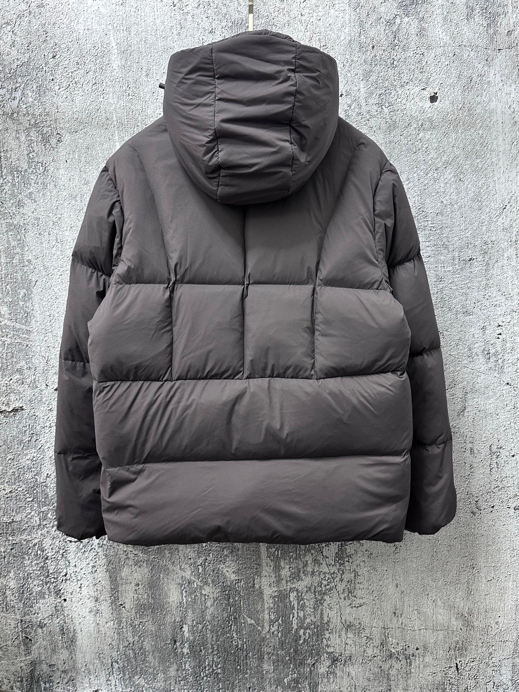 Long padded jacket with attached hood and full-zip front, dark gray