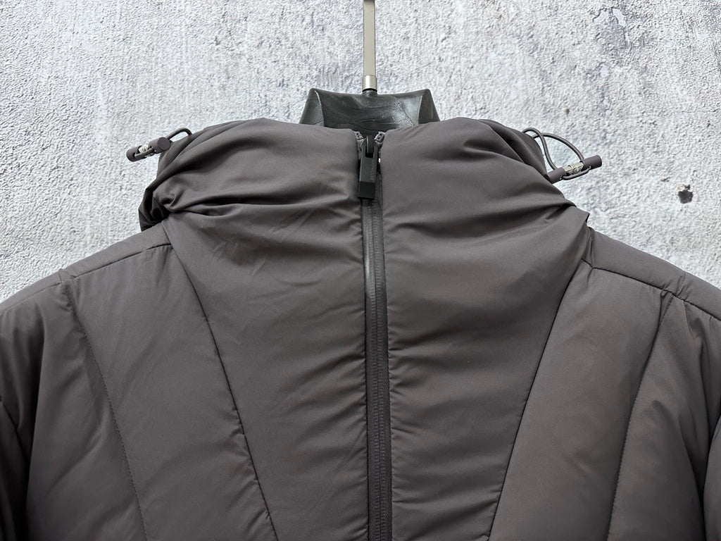 Long padded jacket with hood, high collar, and full-zip front, dark gray