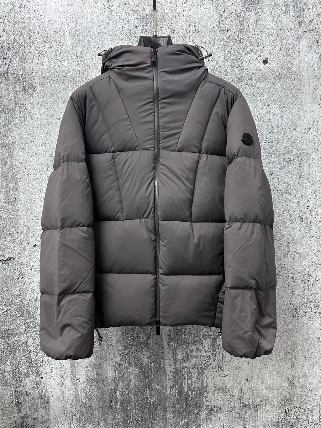 Long padded jacket with full-zip front and hood, dark gray