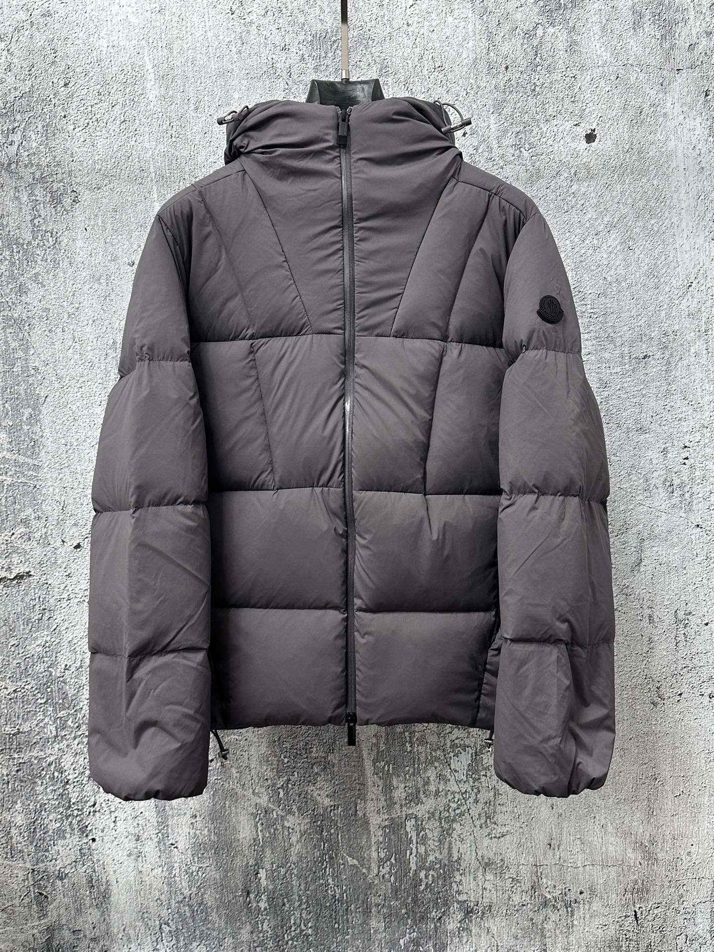 Long padded jacket with full-zip front and hood, dark gray