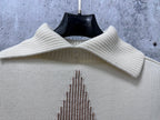 Dior knit sweater neckline close-up with ribbed collar and star motif