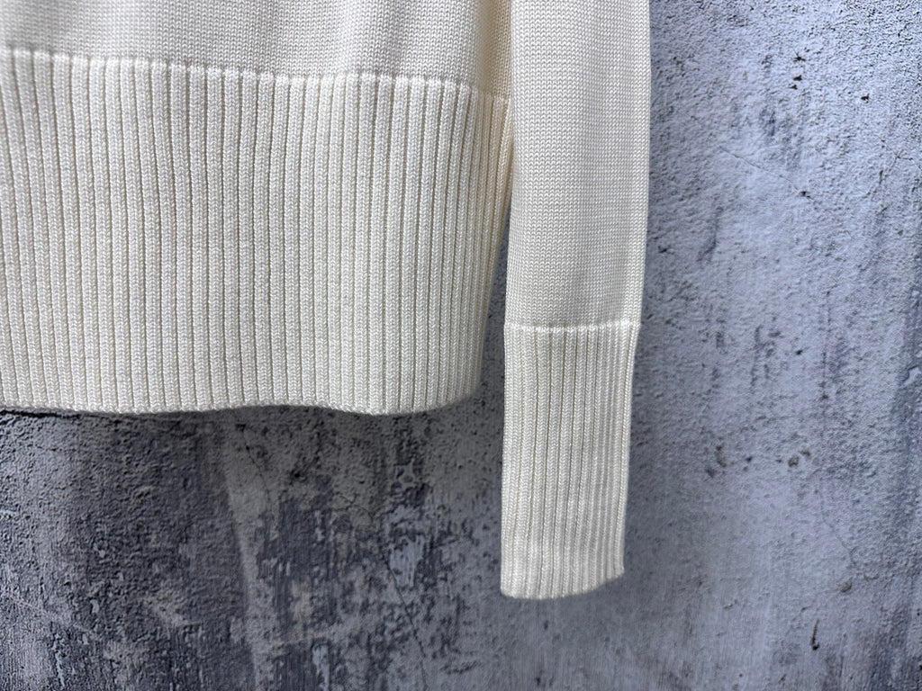 Dior knit sweater sleeve with ribbed cuff and subtle stripe band