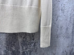Dior knit sweater sleeve with ribbed cuff and subtle stripe band