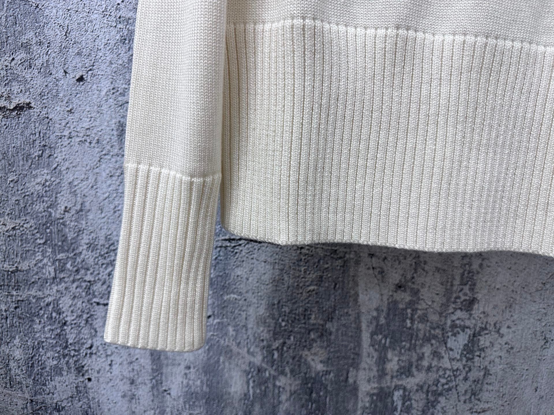 Dior knit sweater cuff and lower sleeve with ribbed knit and stripe band