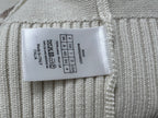 Dior knit sweater size label tag on ribbed knit fabric
