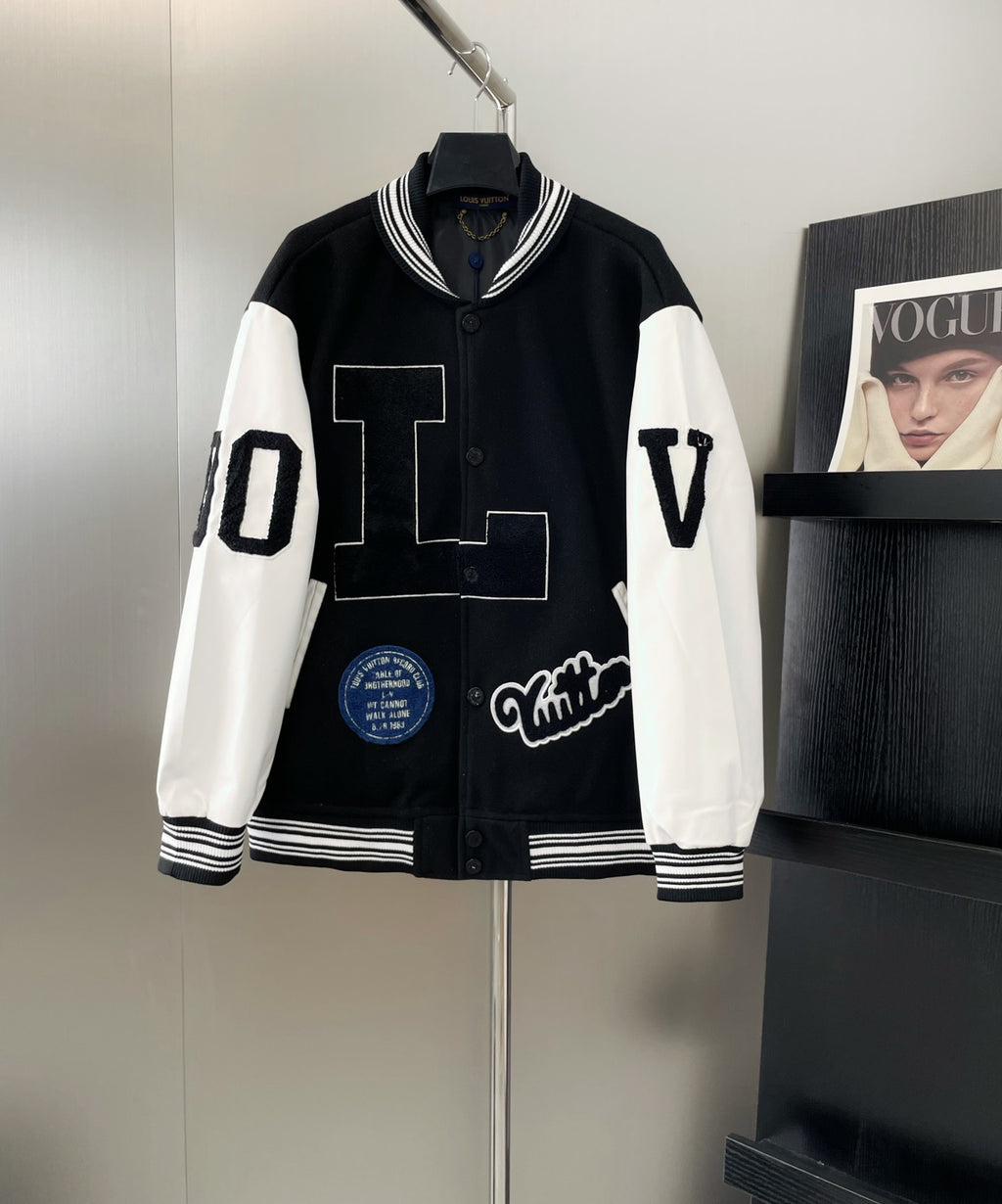 Louis Vuitton long varsity jacket, black with white sleeves, striped ribbed trim, button front