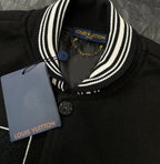 Louis Vuitton long varsity jacket collar close-up, black knit with white striped trim