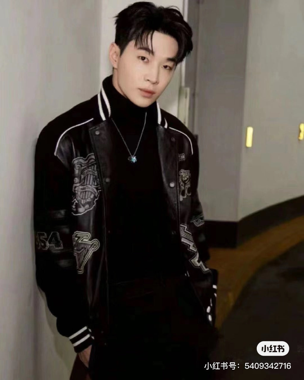Louis Vuitton long varsity jacket, black with white striped collar and graphic patch sleeves