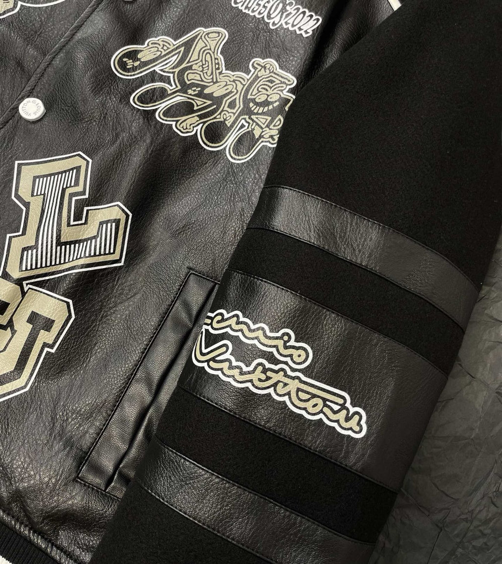 Louis Vuitton leather-look varsity jacket sleeve with striped band and patch graphic detail