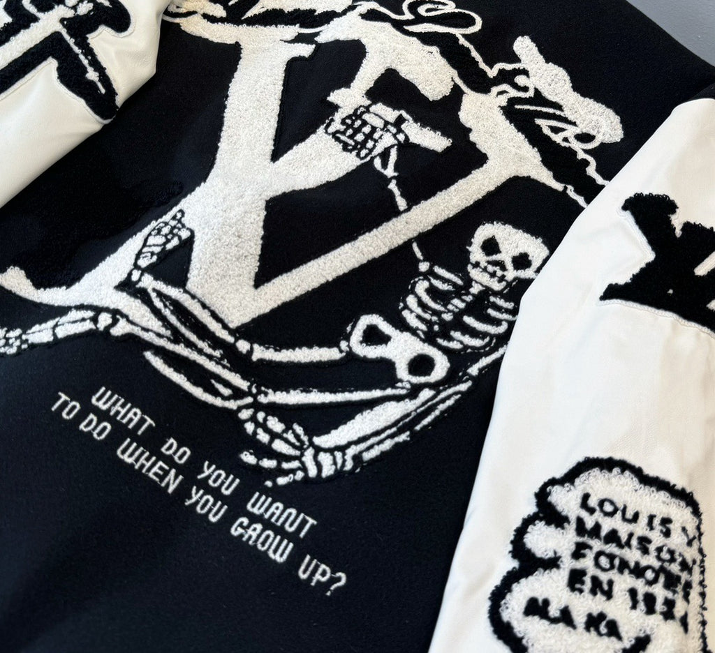 Close-up of jacket back graphic with text details on black panel and white sleeve