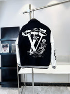 Black and white varsity-style jacket with large back graphic and striped ribbed hem