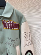 Light blue jacket sleeve, embroidered patch and printed graphic on ribbed cuff