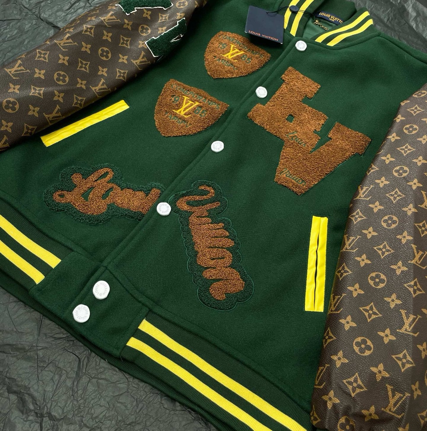 Green Louis Vuitton jacket with front embroidery and yellow striped neckline trim