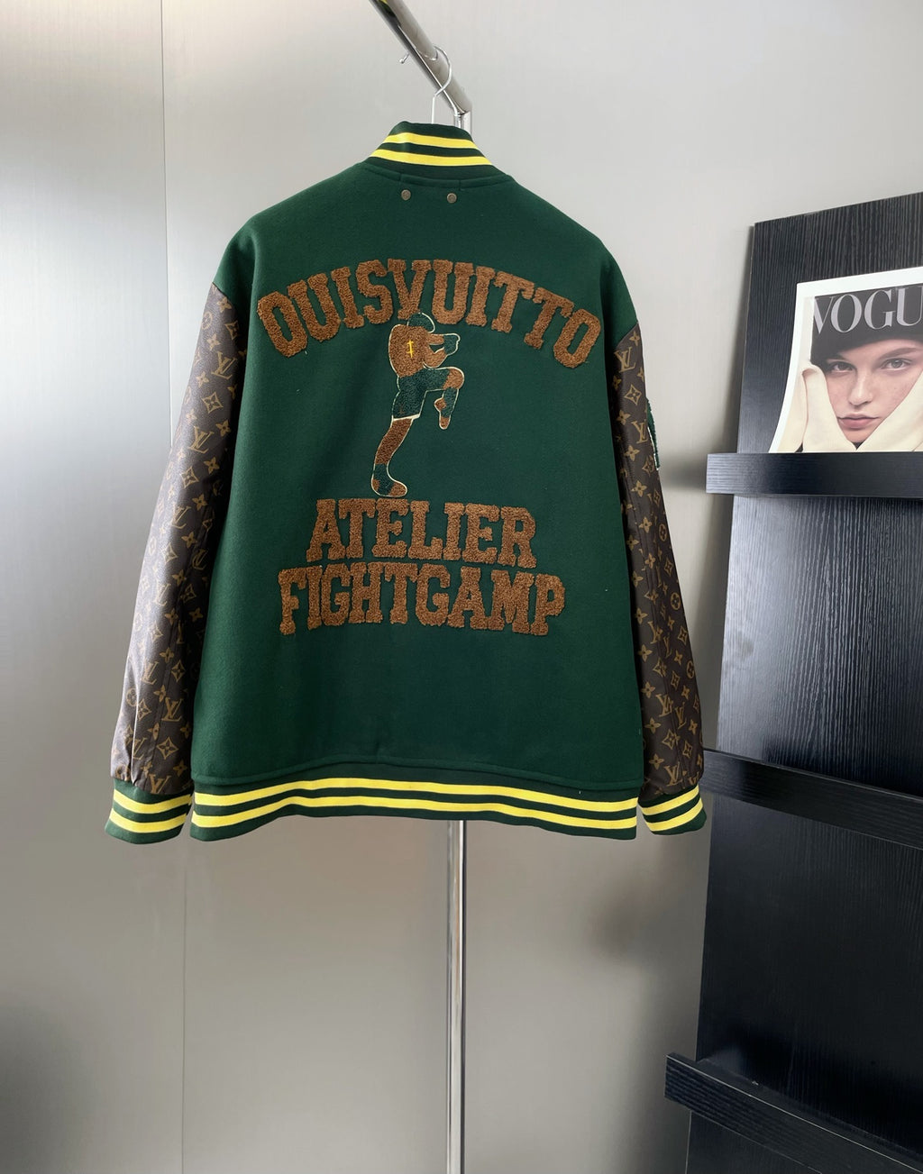 Green Louis Vuitton jacket back with large embroidered text and striped cuffs