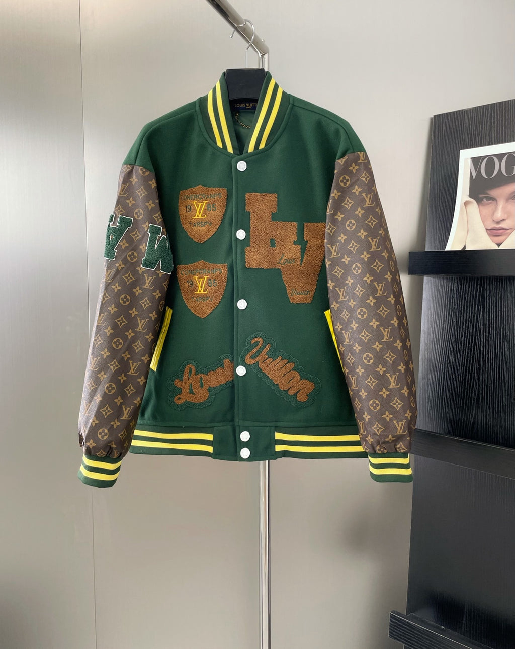 Green Louis Vuitton long-sleeve jacket with snap buttons and striped trim