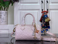 Louis Vuitton mini bag in light pink with embossed monogram, top handles and shoulder strap
