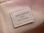 Louis Vuitton light pink bag leather label reading “LOUIS VUITTON PARIS made in France”