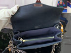 Dark teal flap bag interior with zipper pocket and gold-tone chain strap