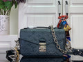 Dark teal monogram crossbody bag with flap, chain strap, and front clasp pocket