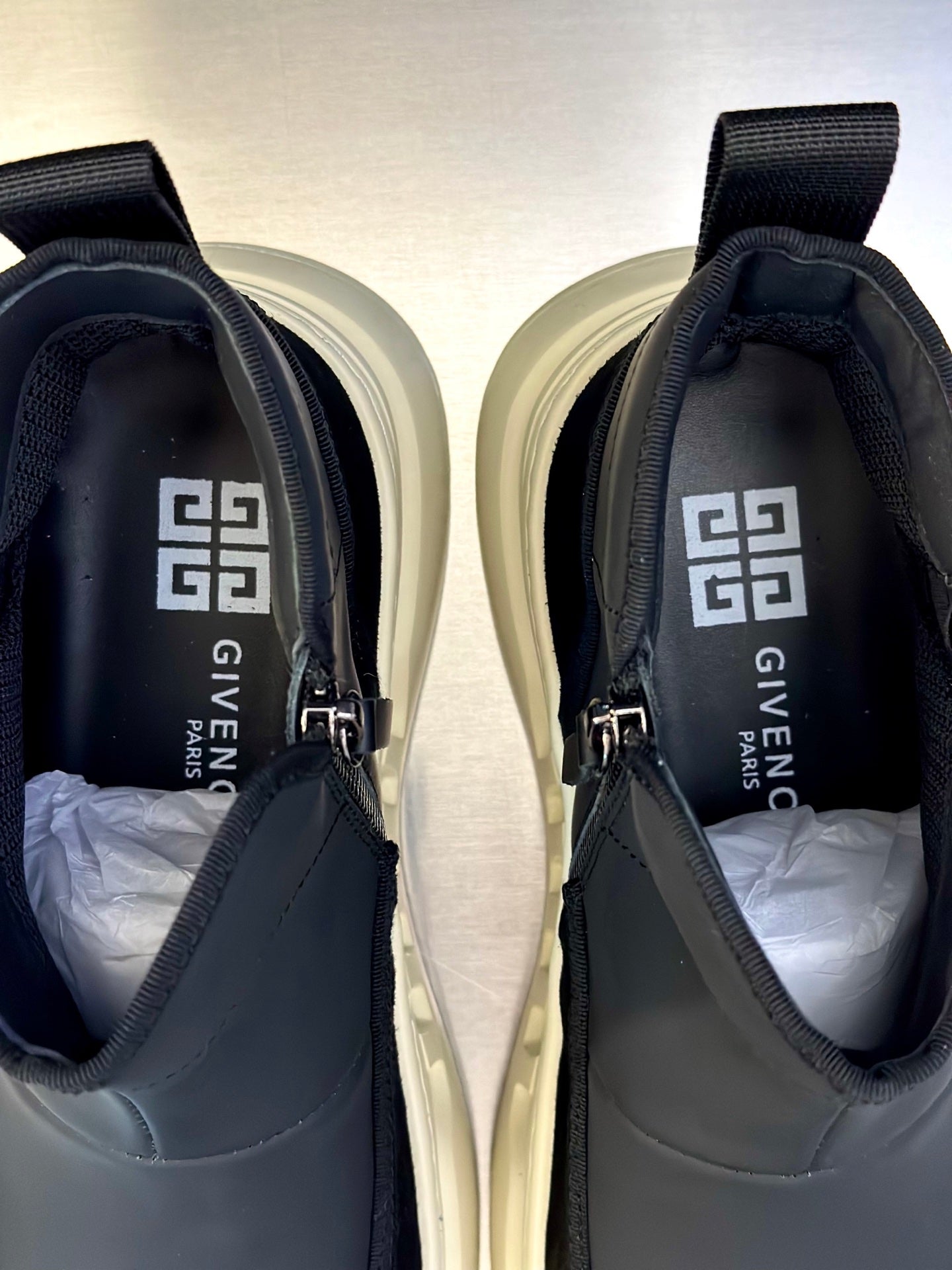 Dark gray ankle sneakers with zip, padded collar, and Givenchy text lining