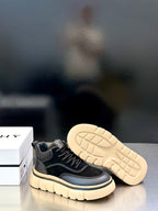 Black Givenchy sneaker with open sole tread visible, cream platform base