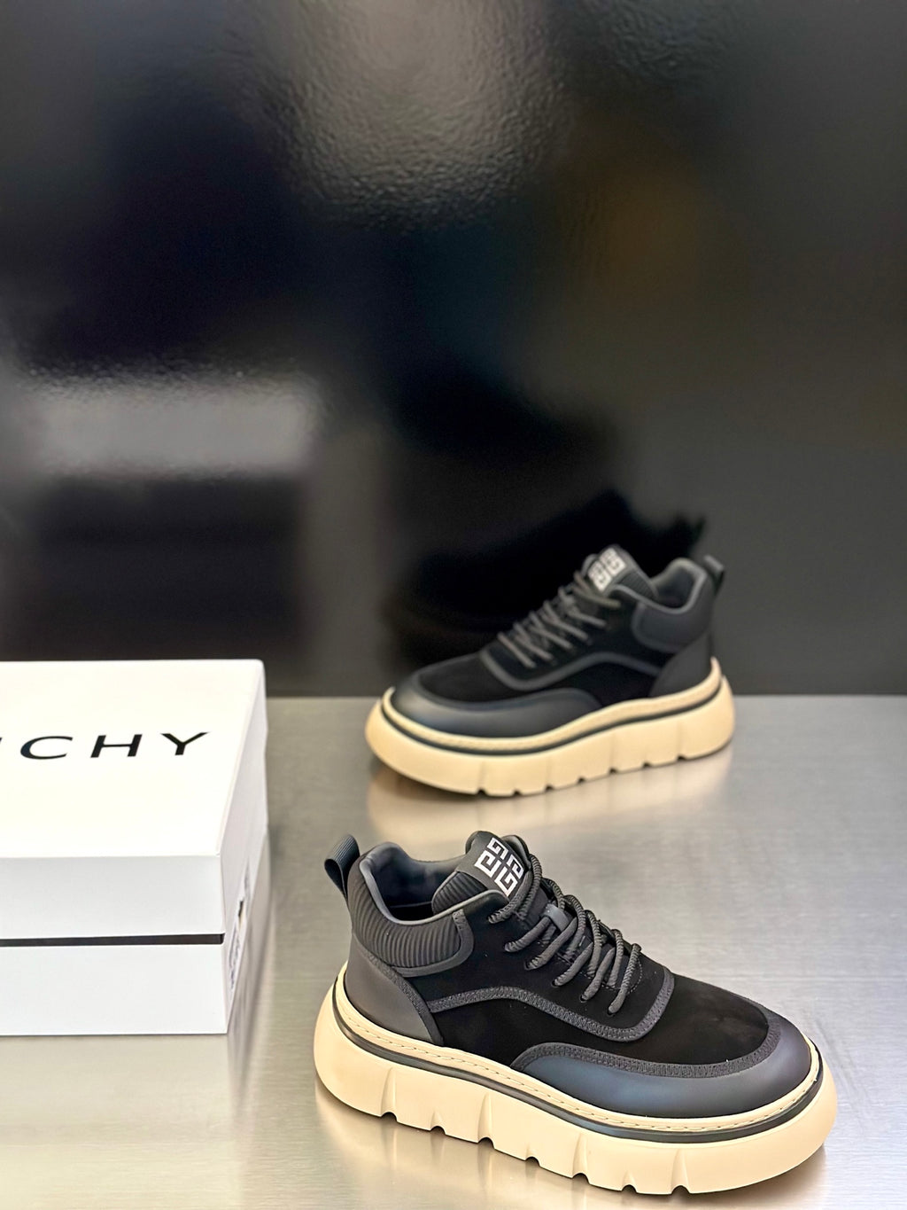 Black lace-up Givenchy sneakers with logo tongue and cream outsole