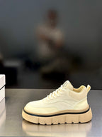 Givenchy cream low-top sneakers on display, lace-up front with logo patch and platform sole