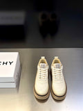 Givenchy cream leather sneakers with lace-up front, logo tongue patch, and chunky sole