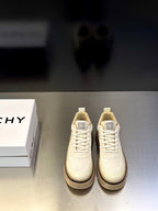Givenchy cream leather sneakers with lace-up front, logo tongue patch, and chunky sole