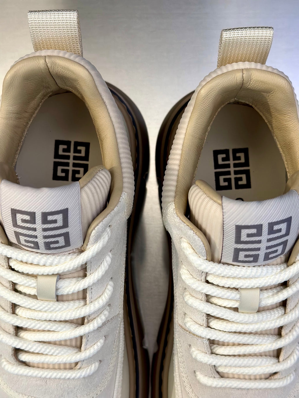 Givenchy cream sneakers with embossed logo on tongue and heel, laces and cushioned collar