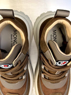Moncler sneakers close-up of tongues and heel with MONCLER branding, brown laces