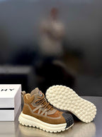 Moncler sneakers outsole view with textured white tread and tan upper