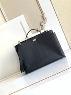 Fendi handbag in dark navy with top handles and adjustable shoulder strap