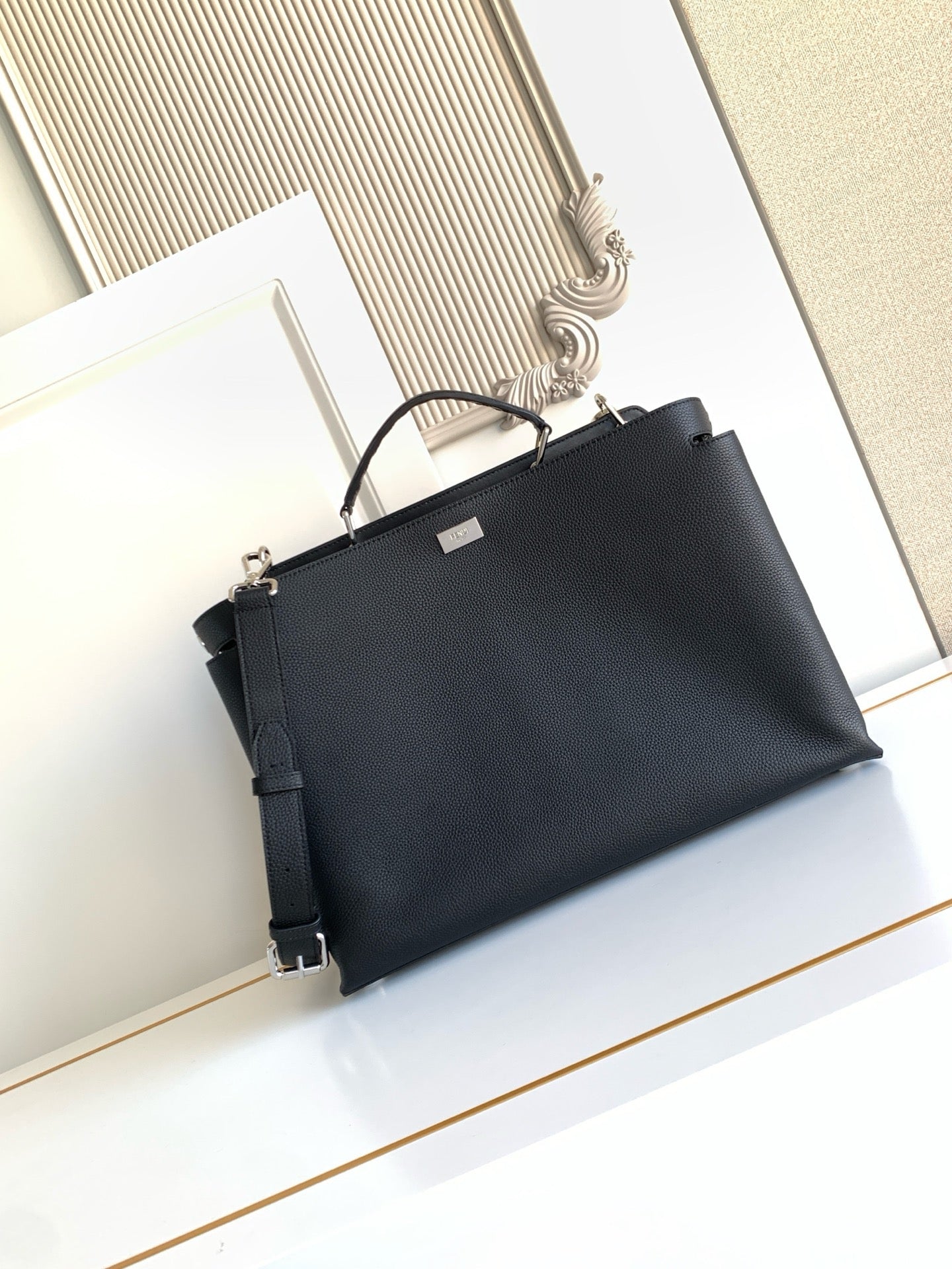 Fendi handbag in dark navy with top handles and adjustable shoulder strap