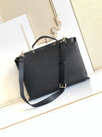 Fendi handbag with structured shape, top handles, and crossbody strap