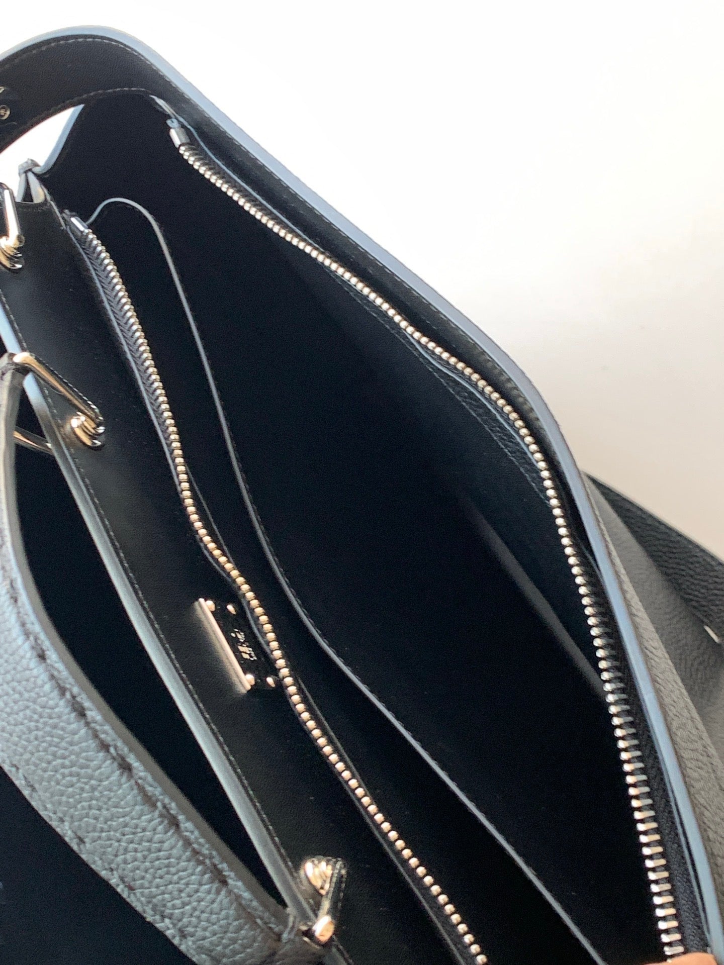 Fendi handbag interior view with zip pocket and stitched lining seams