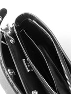 Fendi leather handbag interior with zip pockets and smooth black lining.