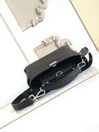 Fendi leather handbag with crossbody strap and zipper closure, black.