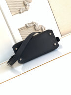 Fendi leather handbag with front snap buttons and shoulder strap, black.