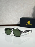 Versace sunglasses with black frames and green tinted lenses